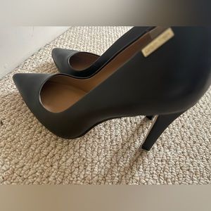 Like new Calvin Klein black pumps worn once size 7.5 US or European 37.5.